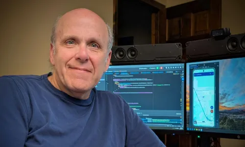 Mike working on his My Elevation app from his home office